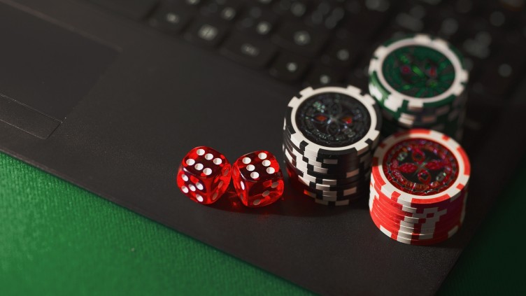 High stakes image of chips and dice